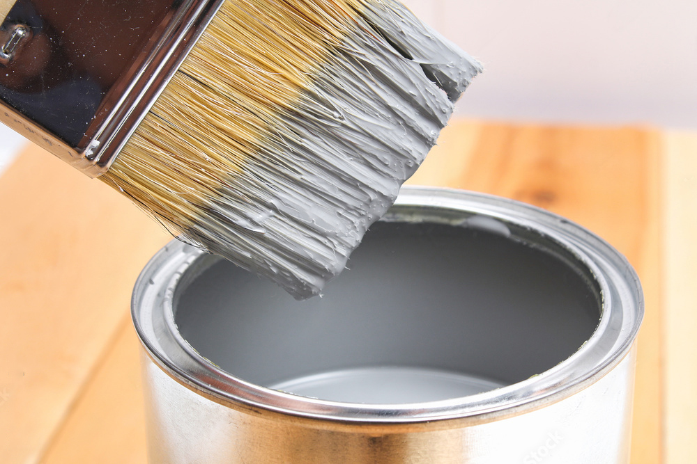 paintbrush and paint can